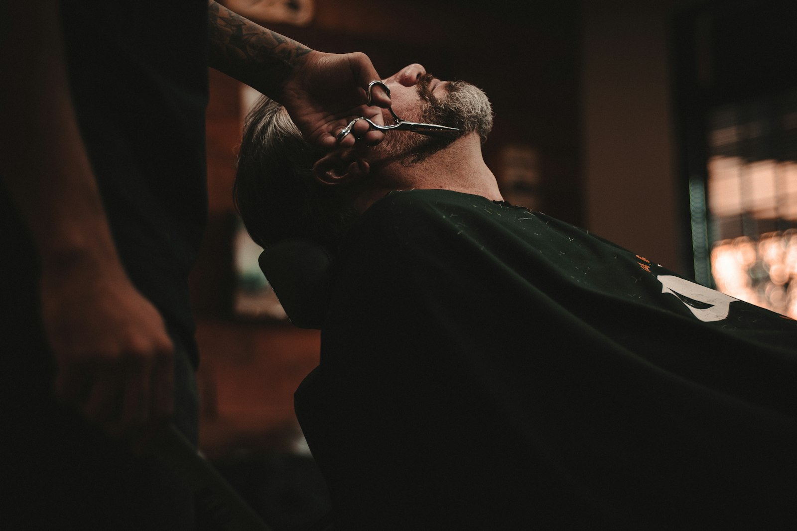 Barber executing a precision fade